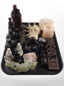 A group of oriental wares including carved hardstone and resin figures, rock crystal candleholders,