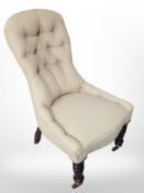 A late Victorian ladies chair in buttoned fabric,