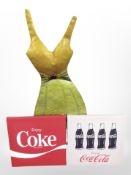 Two Coca Cola wall canvas and a metal wall plaque