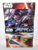 Two Hasbro Disney Star Wars models, Tie Striker and Tie Fighter, boxed.