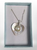 A silver blister pearl necklace.