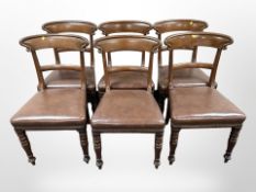 Six Victorian carved mahogany dining chairs with studded brown leather seats