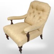 A late Victorian mahogany armchair in the Regency style, raised on ceramic castors,
