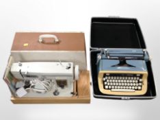 A Winfield electric sewing machine with lead and pedal, and an Imperial typewriter in carry case.