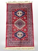 A machine-made eastern rug/wall hanging,