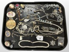 A group of costume jewellery, necklaces, compact,