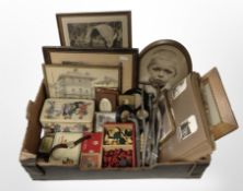 A group of vintage tins, picture frames containing portrait photographs, photograph album,