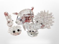 Five Swarovski crystal figures including hedgehog, pig, frog, etc.