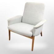 A Danish teak-framed lounge chair in pale blue upholstery, width 79cm.