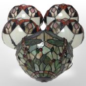 A Tiffany-style leaded glass wall light decorated with dragonflies, width 30cm,