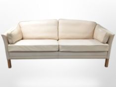 A late 20th century Danish leather three seater settee,