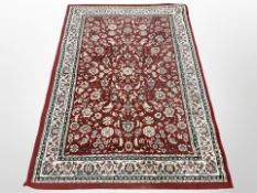 A machine-made rug of Persian design,