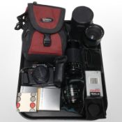 A Pentax P30 camera, together with several lenses including Pentax, Hoya and Photax,