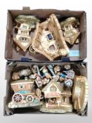 A collection of Pendelfin rabbits and stands.