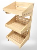 A contemporary pine three-tier stand, height 80cm.