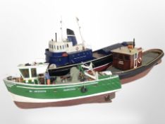 Three scale model remote control trawlers, longest 90cm.