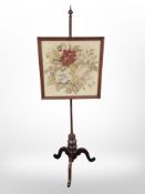 A Victorian mahogany tapestry pole screen,
