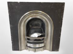 A cast iron and chrome fire insert,