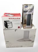 A boxed toaster ceramic fan heater and kitchen chimney hood.