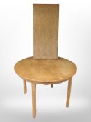 A 20th century Danish oak circular extending dining table,