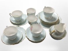 23 pieces of Aynsley floral-decorated tea china on blue ground.