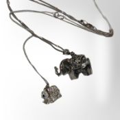 An encrusted elephant pendant on silver chain,