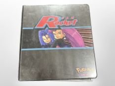 A binder containing a large quantity of collector's cards including X-Men, Starship Troopers,