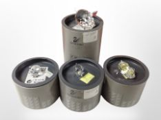 Four boxed Swarovski crystal figures of pigs.