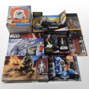 Nine various Hasbro and other figurines, 3D ceramic mug, etc., boxed.