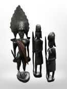 Three African carved figures, tallest 47cm.