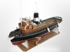 A remote control scale model of a trawler, on stand, length 101cm.