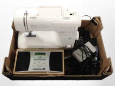 A Toyota super automatic sewing machine, together with an Alber DAB radio,