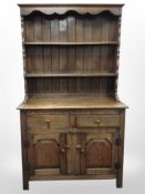 A reproduction oak dresser,