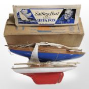 Two model pond yachts, one in original box.