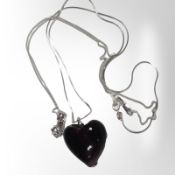 A silver-mounted amethyst glass heart pendant on chain,