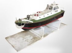 A scale model remote control boat, on stand, length 90cm.