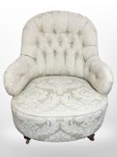 A late Victorian mahogany ladies armchair in cream floral upholstery,