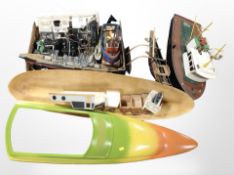 A group of model remote control boat hulls and components, model battleship,