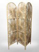 A wicker three fold screen,