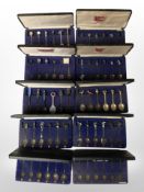 Several cases containing collector's spoons.