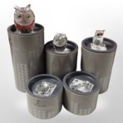 Five boxed Swarovski crystal figures including owls and tortoises.