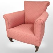 A Regency style armchair in salmon upholstery,