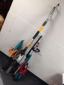 A Bosch electric hedge trimmer, together with a further pole hedge trimmer,