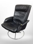 A pair of contemporary black stitched leather swivel armchairs, width 73cm.