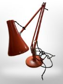 A Herbert Terry & Sons Limited red enamelled angle poised lamp