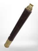 A lacquered brass and leather telescope.