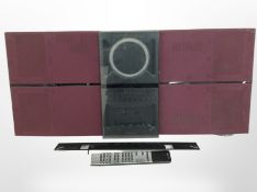 A Bang & Olufsen BeoSound Century music system, with lead and remote (continental plug).