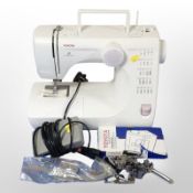 A Toyota electric sewing machine with lead and pedal.