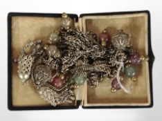 Three Lariat white metal necklaces, variously strung with glass beads, filigree charms, etc.