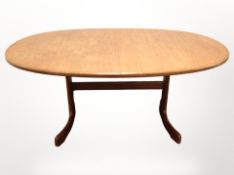 A G Plan teak extending oval dining table with one leaf,